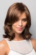 Woman in medium auburn long curly bob wig with shorter layers along the face