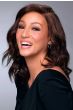 Woman in a shoulder length dark auburn curly human hair wig
