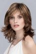 Woman in a shoulder length deep red layered bob wig with side bangs