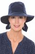 Woman in navy blue cloche or safari style summer hat with brim