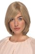 Woman in a shoulder length layered bob wig with long side bangs