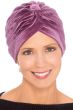Woman in pink velour turban for women with cancer