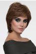 Woman in a shoulder length short light brown wig with long layers and side bangs