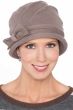 Woman in taupe colored cotton cloche style hat for cancer patients