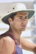 Man in white bucket style summer sun hat with chin strap
