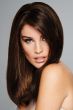 Woman in a long dark auburn human hair topper for thinning hair