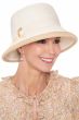 Woman in white cloche style hat for spring and summer for cancer patients