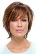 Woman in a chin length medium auburn bob wig with side bangs and feathered layers