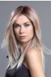 Woman in an extra long straight red to light blonde lace front wig
