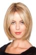 Woman in a chin length strawberry blonde lace front wig with curtain bangs