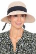 Woman in straw summer visor hat with big brim in the front for sun protection and more narrow brim in back