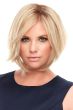 Woman in an 8" light blonde layered wiglet hair topper