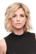 Woman in a curly 8" light blonde human hair topper with an extra large base