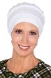 Woman in white beanie cap turban with embroidered detail for women with cancer