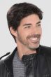 Man in a short black lace front wig