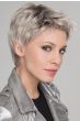 Woman in a classic short grey pixie wig with dark roots
