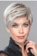 Woman in a platinum blonde pixie wig with longer layers on the top and sides