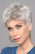 Woman in a tousled light grey classic pixie wig