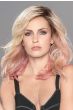 Woman in a past the shoulders blonde and pink curly lace front wig with dark roots