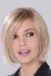 Woman in a chin length shaggy light blonde lace front bob wig