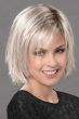 Woman in a chin length razor cut platinum blonde lace front wig