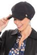 Woman in black stripe newsboy cap for women with cancer