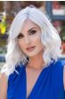 Woman in a shoulder length medium auburn curly lace front wig