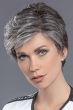 Woman in a tousled salt and pepper layered human hair pixie wig