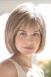 Woman in brown short chin length bob wig with layers and bangs