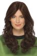 Woman in an extra long curly dark brown human hair wig with long curtain bangs