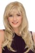 Woman in an extra long light blonde layered wig with textured bangs