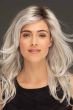 Woman in an extra long tousled platinum blonde lace front layered wig