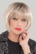 Woman in a chin length platinum blonde bob wig with textured bangs