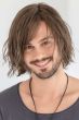 Man in a chin length tousled medium brown lace front wig
