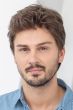 Man in a short medium brown lace front wig with longer hair on top