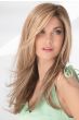Woman in an extra long light blonde layered lace front wig