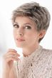 Woman in a light brown cropped lace front pixie wig
