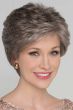 Woman in a long evenly layered brown and grey lace front pixie wig