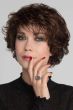Woman in an evenly layered dark auburn curly bob wig