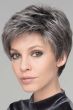Woman in a tousled salt and pepper classic pixie wig