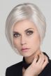 Woman in a chin length asymmetrical platinum blonde angled bob wig
