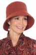 Woman in grey structured winter lampshade shaped hat with brim