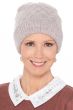 Woman in light colored cute winter beanie hat with cuff and diamond shaped stitching