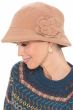 Women in beige fleece fall and winter bucket hat with band and embroidered flower accent on the side