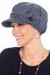Woman in blue and white pinstripe tweed newsboy hat with bow and button on the wide
