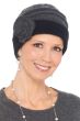 Woman in 2 tone grey winter wool beanie hat with accordion pleats throughout crown and embroidered side flower