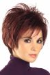 Woman in a spiky burgundy long pixie wig with wispy bangs