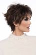 Woman in a short dark brown human hair wig with longer layers along the top and sides