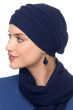 Woman in dark blue chemo cap head covering with slouchy back