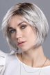 Woman in a chin length light grey stacked lace front bob wig with side bangs